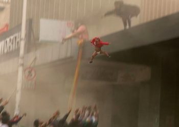 Desperate Mom trapped in Durban Looting throws child from smoke-filled building