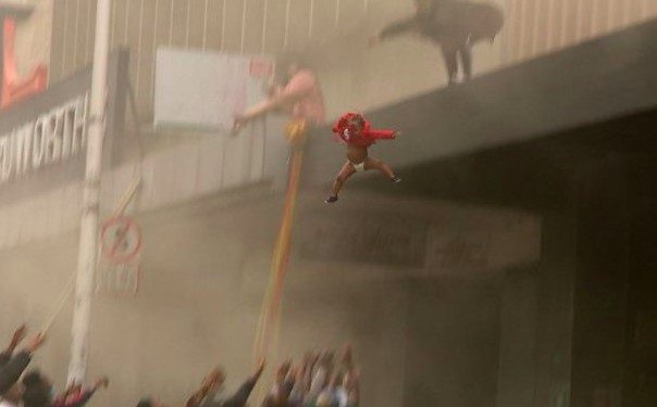 Desperate Mom trapped in Durban Looting throws child from smoke-filled building