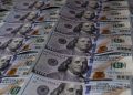 Dollar Gains as Oil Rises Ahead of Key US Inflation Data